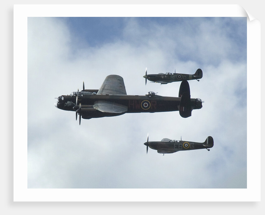 2011 Goodwood Revival Meeting, Lancaster bomber and 2 Spitfires in aerial display by Unknown