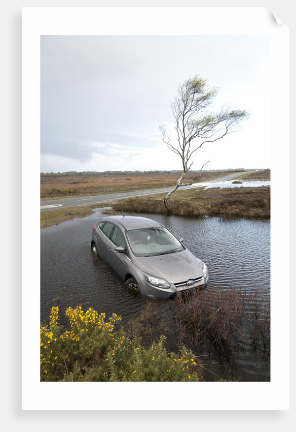 Ford Focus in flooded ditch after losing control on wet road 2012 by Unknown