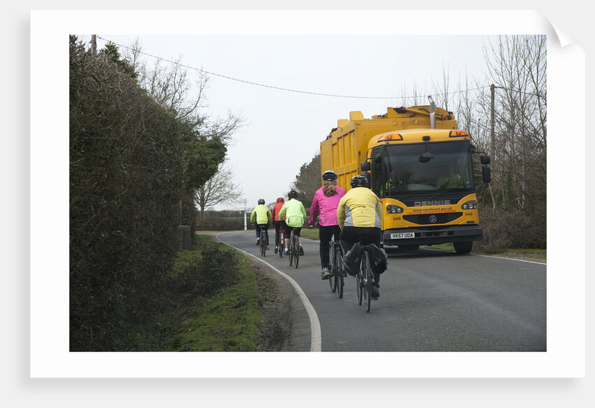 Group of cylists encounter refuse truck on country road in New Forest 2014 by Unknown