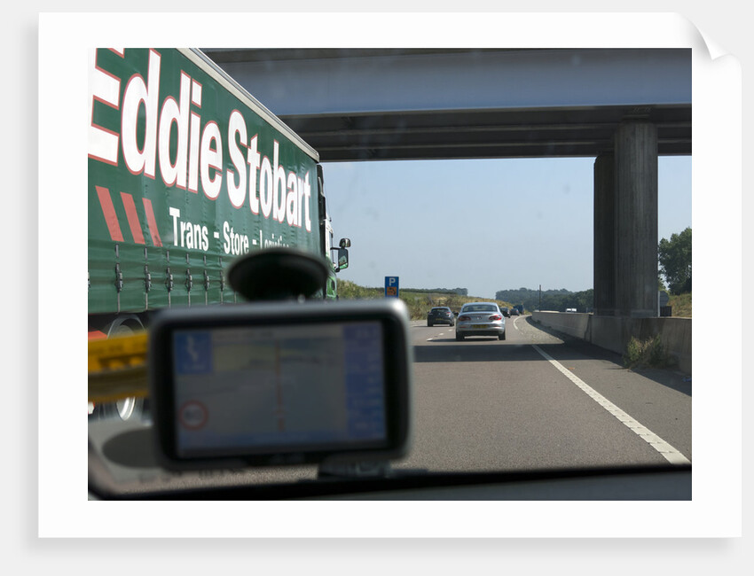 Passing Eddie Stobart truck on the A46 with satnav screen on windscreen by Anonymous