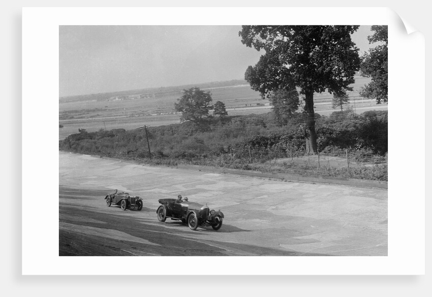 Bentley of FE Elgood and MG Magna of MB Watson racing at a MCC meeting, Brooklands, Surrey, 1933 by Bill Brunell