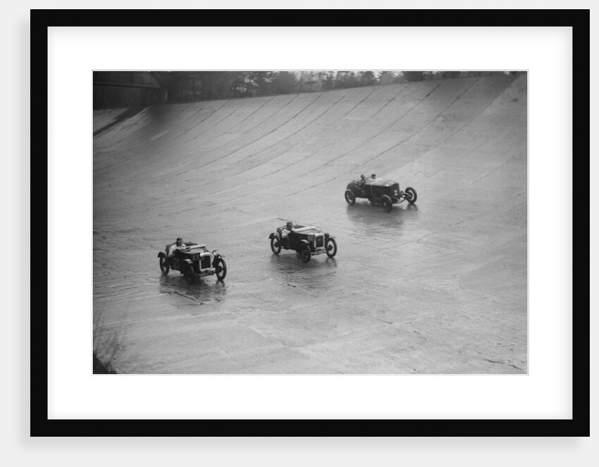 Two Austin 7s and an unidentified car racing at a BARC meeting, Brooklands, Surrey, 1931 by Bill Brunell