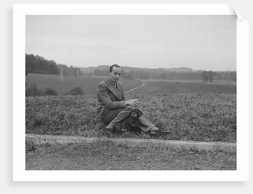 British racing driver Charles Mortimer and his pet dachshund, c1930s by Bill Brunell