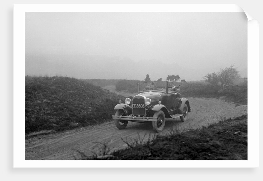 Kitty Brunell driving a 1930 2-seater Ford Model A, 1931. by Bill Brunell