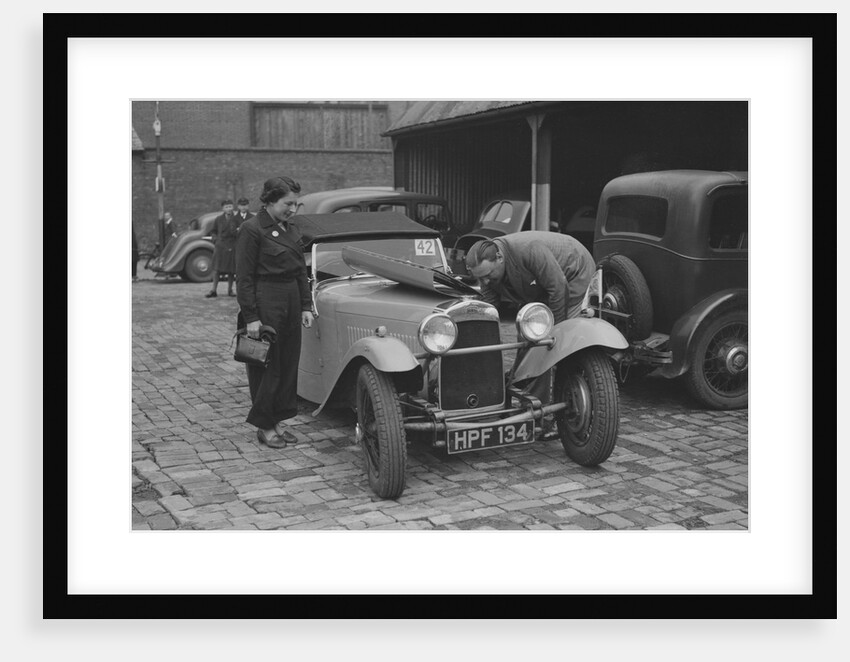 AES Curtis looking under the bonnet of his HRG at the RAC Rally, 1939 by Bill Brunell