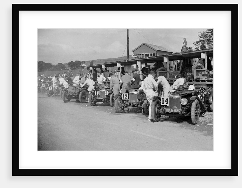 Triumph and Riley cars in the pits at the RAC TT Race, Ards Circuit, Belfast, 1929 by Bill Brunell