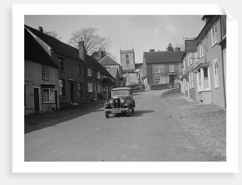 Standard Sixteen saloon driving down the High Street, Hambledon, Hampshire, 1930s by Bill Brunell