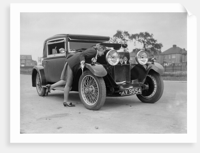 Kitty Brunell looking under the bonnet of a Talbot 14/45 sportsman's coupe, c1928 by Bill Brunell