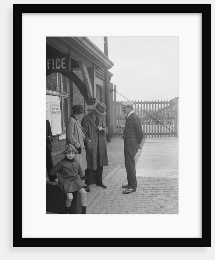 Group of people outside a Metropolitan Line railway station, London, 1930s. by Bill Brunell