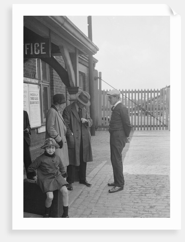 Group of people outside a Metropolitan Line railway station, London, 1930s. by Bill Brunell