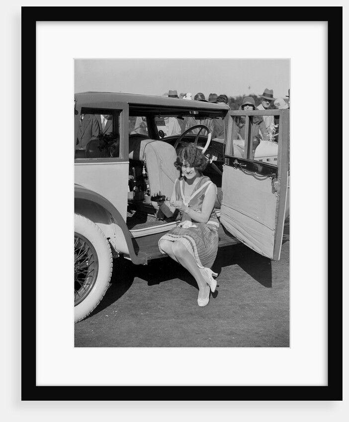 Paddy Naismith pouring a drink from the cocktail bar in her Ballot at the Southport Rally, 1928 by Bill Brunell