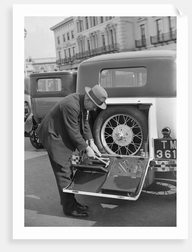 A driver opening the fitted toolkit of his Ford Model A at the Southport Rally, 1928 by Bill Brunell