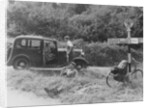 People relaxing by a signpost with a 1935 Standard 10 hp car, Devon, (c1935?) by Unknown