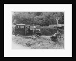 People relaxing by a signpost with a 1935 Standard 10 hp car, Devon, (c1935?) by Unknown