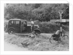People relaxing by a signpost with a 1935 Standard 10 hp car, Devon, (c1935?) by Unknown