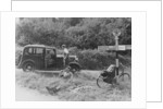 People relaxing by a signpost with a 1935 Standard 10 hp car, Devon, (c1935?) by Unknown