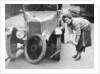 Ivy Cummings changing a tyre on a 1925 Singer 10/26, London, c1925 by Unknown