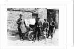 Bedford standing at the front of a car, with onlookers by Unknown