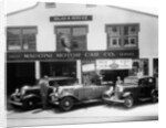 1932 Ford V8 in front of a car showroom, (c1932?) by Unknown