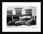 1932 Ford V8 in front of a car showroom, (c1932?) by Unknown