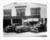 1932 Ford V8 in front of a car showroom, (c1932?) by Unknown