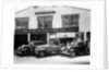 1932 Ford V8 in front of a car showroom, (c1932?) by Unknown