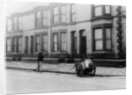 An 'Orderly Boy' and his cart sweeping a street, Liverpool, 1935 by Unknown