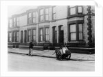 An 'Orderly Boy' and his cart sweeping a street, Liverpool, 1935 by Unknown