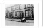An 'Orderly Boy' and his cart sweeping a street, Liverpool, 1935 by Unknown