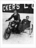 Tudor and Thompson riding a motorcycle and sidecar by Unknown