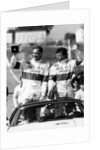 John Watson and Jan Lammers waving at the crowds at Jarama, Spain, 1987 by Unknown