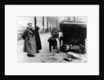 Lord Northcliffe's chauffeur changing a tyre, (c1908?) by Unknown