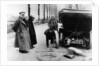 Lord Northcliffe's chauffeur changing a tyre, (c1908?) by Unknown