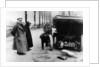 Lord Northcliffe's chauffeur changing a tyre, (c1908?) by Unknown