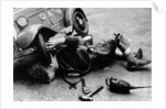 Michael Ware repairing his pedal car by Unknown
