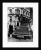 Female chauffeur standing by a 1964 Morris Oxford, 1964 by Unknown