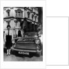 Female chauffeur standing by a 1964 Morris Oxford, 1964 by Unknown
