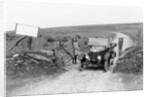 A Morris Bullnose driving through a gateway, early 1920s by Unknown