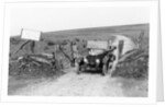 A Morris Bullnose driving through a gateway, early 1920s by Unknown