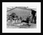 Gutting fish outside a warehouse in Whitby, North Yorkshire, 1959 by Unknown