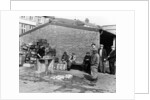 Gutting fish outside a warehouse in Whitby, North Yorkshire, 1959 by Unknown