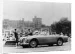 An Aston Martin DB2-4 MKII, with Windsor Castle in the background, 1956 by Unknown