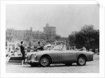 An Aston Martin DB2-4 MKII, with Windsor Castle in the background, 1956 by Unknown