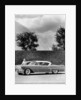 Woman with a 1957 Cadillac coupe de ville by Anonymous