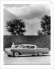 Woman with a 1957 Cadillac coupe de ville by Anonymous