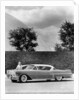 Woman with a 1957 Cadillac coupe de ville by Anonymous