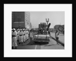 Models and a Cadillac on a parade, USA, (c1959?) by Unknown