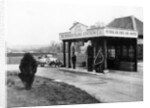 1923 10 hp Calcott arriving at a petrol station by Anonymous