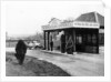 1923 10 hp Calcott arriving at a petrol station by Anonymous