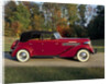 A 1936 Auburn 852 car on a gravel driveway in the autumn sunlight by Unknown